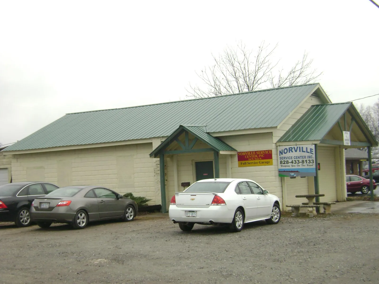 Green metal roof on a service garage with a covered entry in Hoyt
